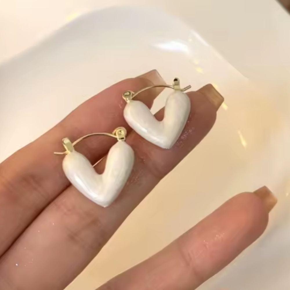 Heart shaped enamel stud earrings; off white glaze; NWOT